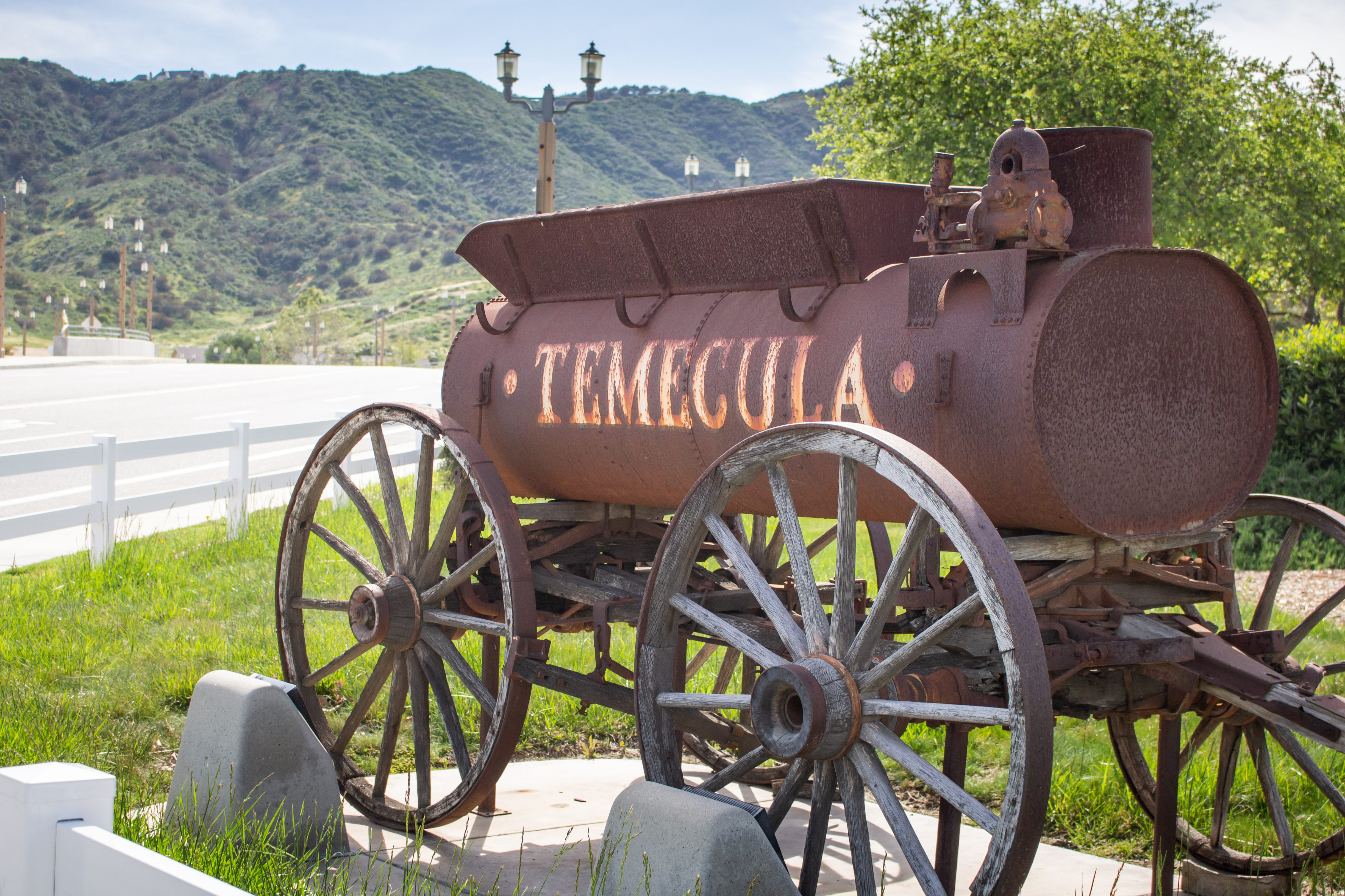 A vintage iron tank antique ornament on the corner to the entrance to downtown Temecula.